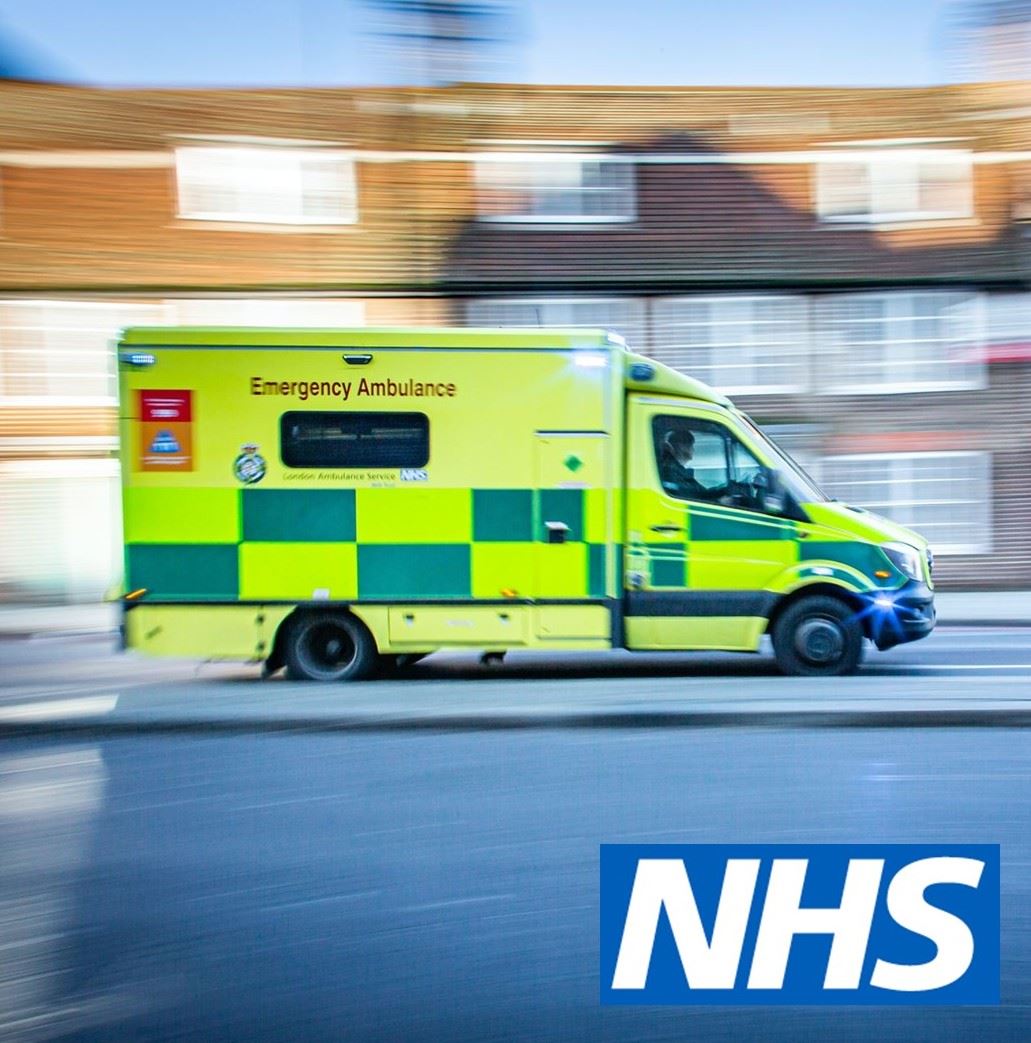 an ambulance responding to an event and the NHS logo